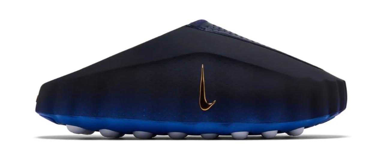 Black and blue shoe with a gold logo on a white background
