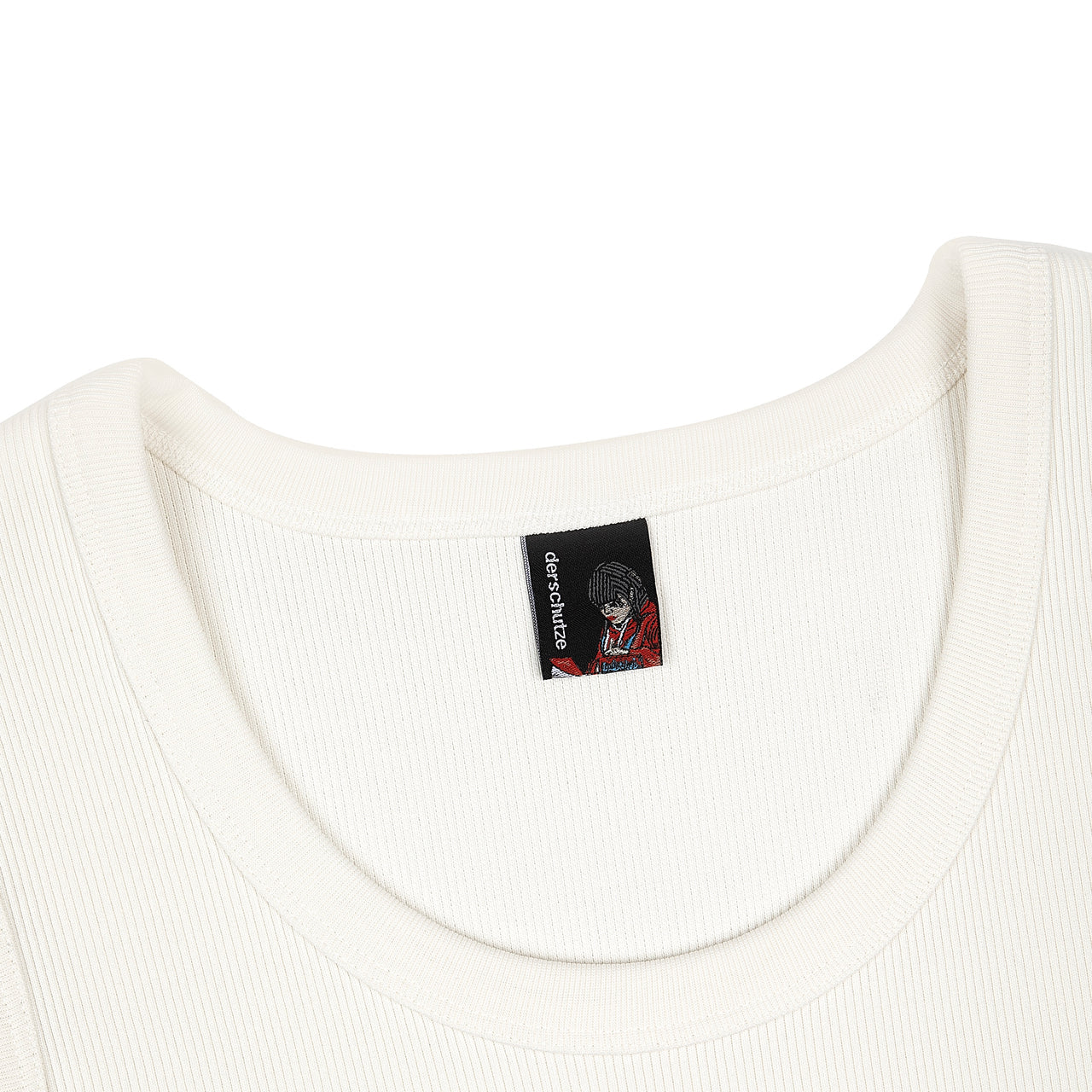 Close-up of a white garment with a brand label featuring an illustration on a white background