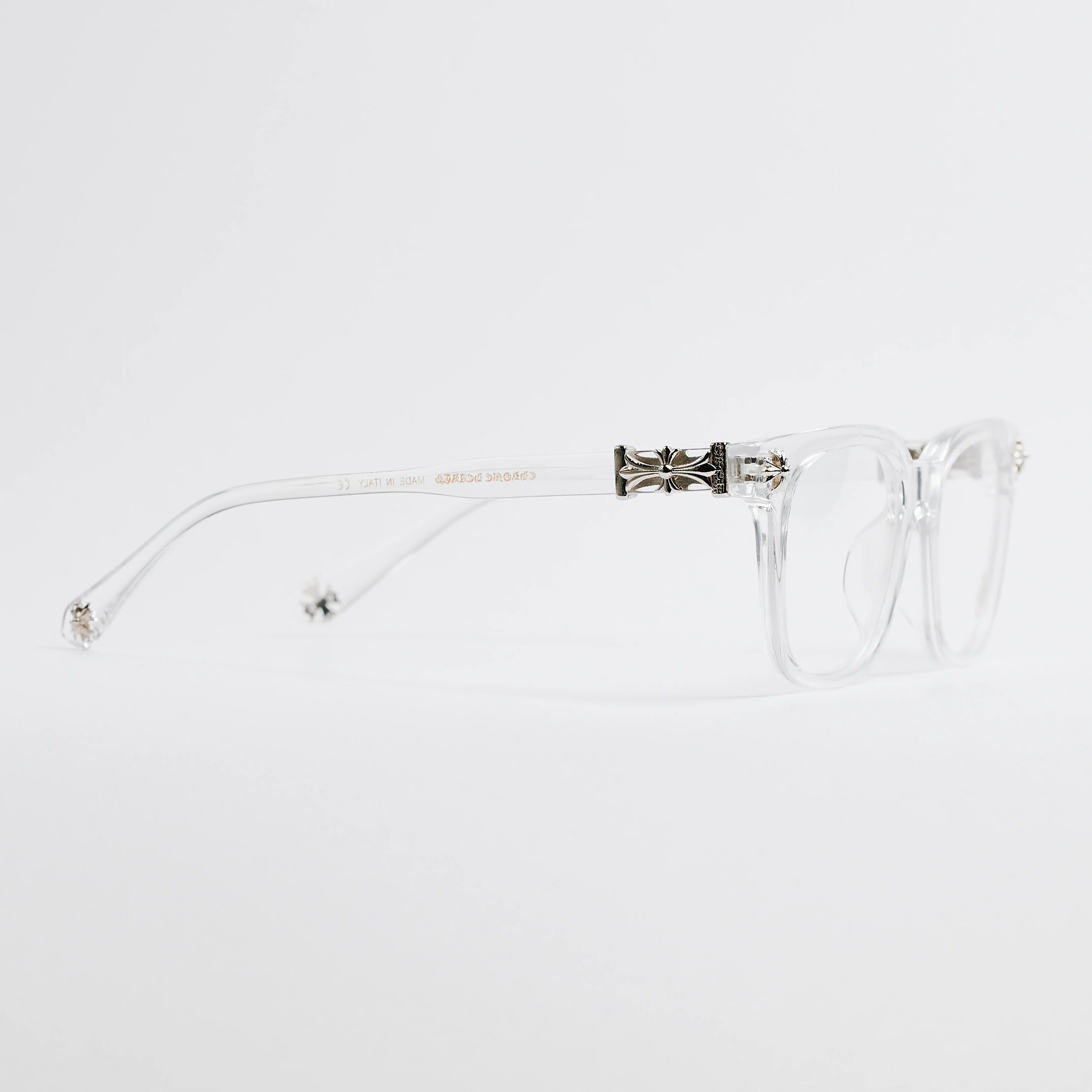 Clear eyeglasses with a decorative temple on a white background